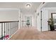 Upstairs hallway with neutral colors, access to multiple rooms, and an overlook at 3865 Brookhollow Dr, Douglasville, GA 30135