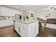 Kitchen island view highlights the granite counters, stainless steel appliances, and open layout to the living room at 3865 Brookhollow Dr, Douglasville, GA 30135