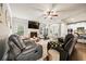 Cozy living room with a fireplace, TV, and an open view to the kitchen and dining area at 3865 Brookhollow Dr, Douglasville, GA 30135