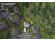 Aerial view of a home with a spacious lot in a wooded neighborhood in Grayson, GA at 414 Silver Top Dr, Grayson, GA 30017