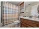 Cozy bathroom with a wooden vanity, shower/tub combination, and tasteful decor for a relaxing experience at 414 Silver Top Dr, Grayson, GA 30017
