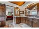 Bathroom features dual sinks, wood cabinets, and barn door entry to the main bedroom and closet at 414 Silver Top Dr, Grayson, GA 30017
