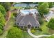 Aerial view of a community clubhouse with a pool, slide, playground, and tennis courts at 414 Silver Top Dr, Grayson, GA 30017