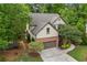 Beautiful house with a two-car garage, neutral siding, mature landscaping, and a driveway at 414 Silver Top Dr, Grayson, GA 30017