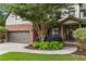 Charming brick home featuring a two-car garage, lush landscaping, and a welcoming front entrance at 414 Silver Top Dr, Grayson, GA 30017