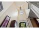 Spacious foyer with high ceilings, transom window and elegant chandelier at 414 Silver Top Dr, Grayson, GA 30017
