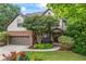 Charming two-story home with a brick and neutral siding exterior, attached two-car garage, and mature landscaping at 414 Silver Top Dr, Grayson, GA 30017