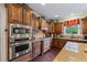 Well-equipped kitchen with stainless steel oven and microwave, granite countertops, and tile backsplash at 414 Silver Top Dr, Grayson, GA 30017