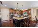 Open kitchen layout features a functional island, wood cabinetry, and modern appliances at 414 Silver Top Dr, Grayson, GA 30017