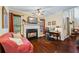 Inviting living room with fireplace, comfortable seating, and a dedicated desk area at 414 Silver Top Dr, Grayson, GA 30017