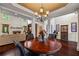 Open-concept living room with fireplace, hardwood floors, and bright light at 414 Silver Top Dr, Grayson, GA 30017