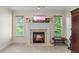 Inviting living room featuring a fireplace, large windows, and a neutral color palette at 414 Silver Top Dr, Grayson, GA 30017