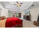 Spacious main bedroom with a fireplace, tray ceiling, and elegant furnishings, creating a serene retreat at 414 Silver Top Dr, Grayson, GA 30017