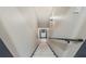 Well-lit stairway with neutral walls, and dark trim creates a modern and inviting transition at 414 Silver Top Dr, Grayson, GA 30017