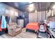 A stylish bedroom with a gaming chair and room to relax at 1050 Kirkland Rd, Covington, GA 30016