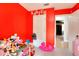 Bedroom features red walls with carpet flooring and a white door at 1050 Kirkland Rd, Covington, GA 30016
