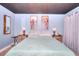 Relaxing bedroom with light blue walls, a dark ceiling, wood decor and a large bed at 1050 Kirkland Rd, Covington, GA 30016