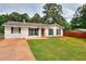 Beautiful single-story home with an established lawn, complemented by a nice yard at 1050 Kirkland Rd, Covington, GA 30016