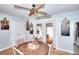 Well-lit kitchen with a breakfast table, patio access, and stainless-steel refrigerator at 1050 Kirkland Rd, Covington, GA 30016