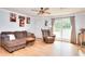 Cozy living room with neutral-colored furniture, hardwood floors, a window, and natural lighting at 1050 Kirkland Rd, Covington, GA 30016