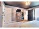 Primary bedroom features a wardrobe, TV and mirror at 1050 Kirkland Rd, Covington, GA 30016