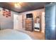 Primary bedroom features a wardrobe, TV and mirror at 1050 Kirkland Rd, Covington, GA 30016