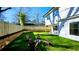 Landscaped backyard with a fire pit and wooden chairs; perfect for outdoor relaxation and entertaining at 1102 Morley Se Ave, Atlanta, GA 30312