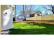 A beautifully landscaped backyard with a fire pit and a newly installed wooden fence for added privacy at 1102 Morley Se Ave, Atlanta, GA 30312