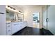 Bright bathroom featuring double vanity and a view of the bedroom through a glass shower door at 1102 Morley Se Ave, Atlanta, GA 30312