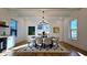 Elegant dining room with a modern chandelier, stylish decor, and an adjacent wet bar at 1102 Morley Se Ave, Atlanta, GA 30312