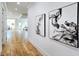 Bright hallway with hardwood floors and a view into the living room and kitchen at 1102 Morley Se Ave, Atlanta, GA 30312