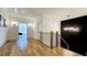 Bright hallway with hardwood floors, modern lighting, and decorative accent wall at 1102 Morley Se Ave, Atlanta, GA 30312