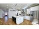 Bright kitchen with a large island, stainless steel appliances, and modern pendant lights at 1102 Morley Se Ave, Atlanta, GA 30312