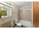 Modest bathroom featuring a tub/shower combination with a decorative wallpaper accent at 4949 Woodland Nw Way, Acworth, GA 30102