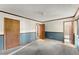 Empty carpeted bedroom exhibiting two closets and an open bathroom at 4949 Woodland Nw Way, Acworth, GA 30102