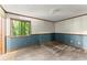 Room featuring a large window with wood trim and a blue accent wall at 4949 Woodland Nw Way, Acworth, GA 30102