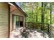 Wood deck accessible from the dining room and living room with views of a lush backyard at 4949 Woodland Nw Way, Acworth, GA 30102