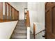 Foyer features carpeted stairs, wood railing, and access to the upper and lower levels of the home at 4949 Woodland Nw Way, Acworth, GA 30102