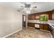Open kitchen featuring wood cabinets, double-basin sink, and neutral flooring at 4949 Woodland Nw Way, Acworth, GA 30102
