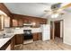 Kitchen features appliances, wood cabinets, and vinyl flooring at 4949 Woodland Nw Way, Acworth, GA 30102