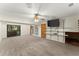 Bright living room features a flat screen tv, sliding glass doors, and a ceiling fan at 4949 Woodland Nw Way, Acworth, GA 30102