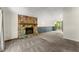 Spacious living room features a stone fireplace, carpet, and sliding door leading to a deck at 4949 Woodland Nw Way, Acworth, GA 30102