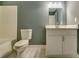 Cozy bathroom with a combination of gray walls, and white cabinets at 6269 Colonial Vw, Fairburn, GA 30213