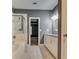 Elegant bathroom with marble shower, soaking tub, and dual sink vanity at 6269 Colonial Vw, Fairburn, GA 30213