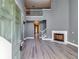 Spacious living room features soaring ceilings, fireplace, and modern gray tones at 6269 Colonial Vw, Fairburn, GA 30213