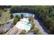 Community amenities include a pool, tennis courts, playground and parking in wooded surroundings at 265 Lee River Cv, Suwanee, GA 30024