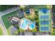 Aerial view featuring the community pool, clubhouse, tennis courts, playground and parking at 265 Lee River Cv, Suwanee, GA 30024