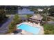 Enjoy the community pool, lake and clubhouse amenities from this stunning aerial view at 265 Lee River Cv, Suwanee, GA 30024