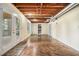 Unfinished basement with exposed ceiling, walk-out to deck, and storage at 265 Lee River Cv, Suwanee, GA 30024