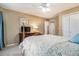 Bright bedroom with neutral walls, carpet floors, and a ceiling fan at 265 Lee River Cv, Suwanee, GA 30024